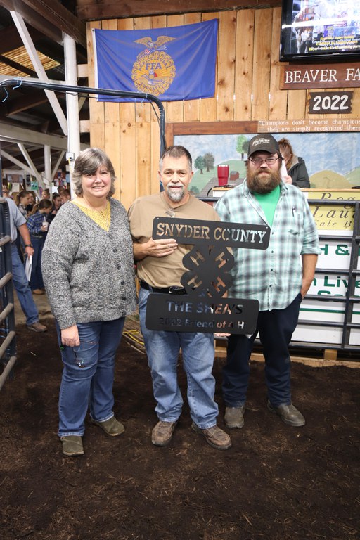 Pictured left to right: Kathy, Brian and Matthew Shea with the metal award they received for this honor.
