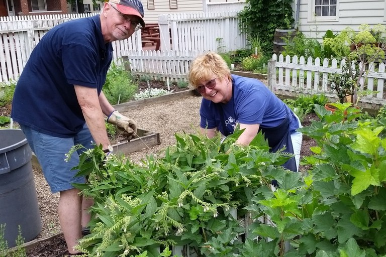 Penn State Master Gardeners Joe Donovic and Marilyn Taylor tending to one of the many demonstration gardens at Old Economy Village.