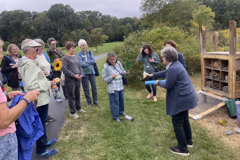 Berks Master Gardeners listening to a presentation about native pollinators at the Snetsinger Butterfly Garden in State College.