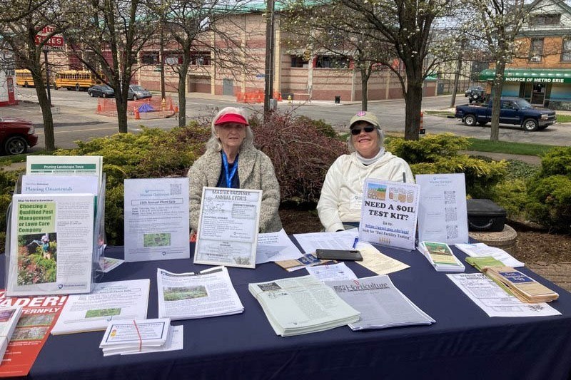 Master Gardeners Jane and LaDonna volunteer at Neighborhood Art House celebration.