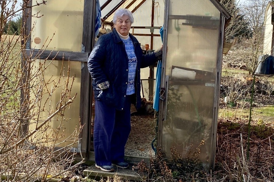 Lifetime Gardener Margaret Milliron of Mount Pleasant Receives “Master Gardener Emerita Award” Peggy Milliron at her greenhouse. Photo credit: Peggy Milliron's daughter.