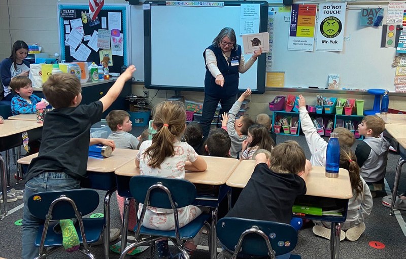 Master Gardener teaching poison prevention in a youth classroom