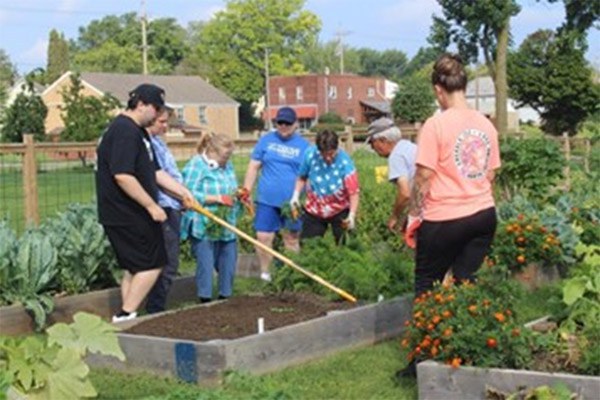 Participants working at the BEST Garden in Erie